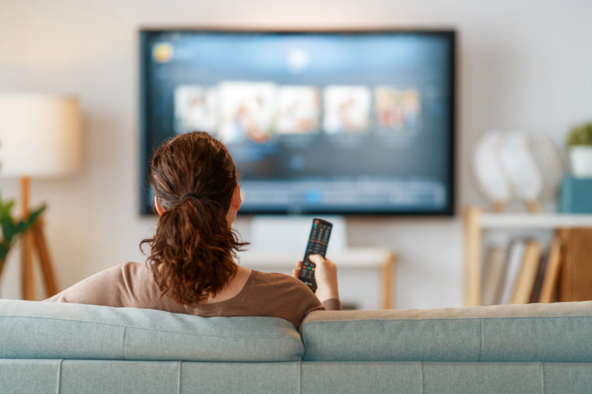 Viewer browsing free streaming services on a living room TV.