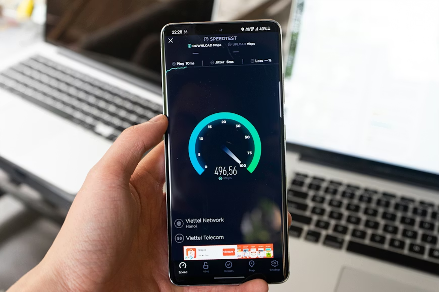 Phone showing a speed test to improve streaming quality on slow internet at home.